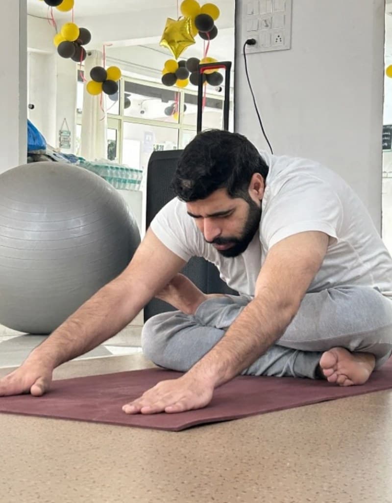 Seated forward fold at Riddhi Siddhi Yoga studio